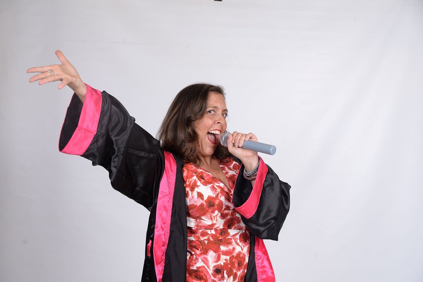 Jen Ables speaking with a microphone